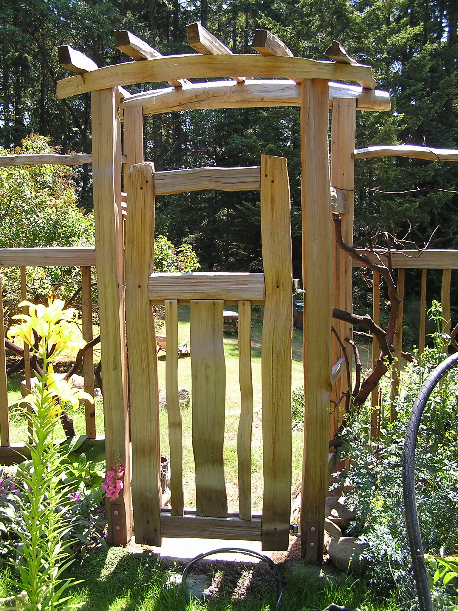 This garden arbor leads into the garden, through a hand split cedar 